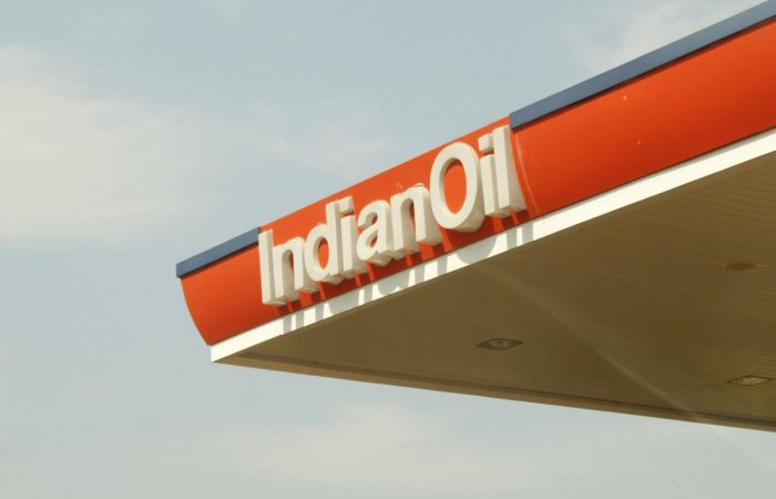 Close-up view of Indian Oil Corporation's petrol station canopy against clear sky.